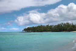 Tropical beach with beautiful water and clouds