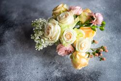 Pastel rose bouquet on grey table