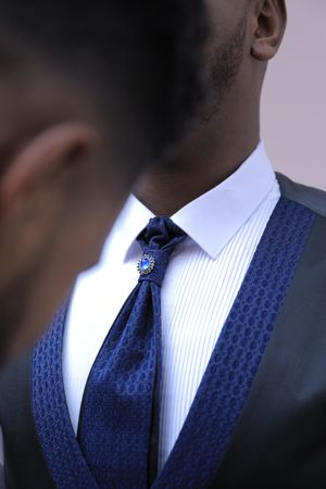 Two Black men in suits in close-up