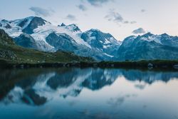 Crystal lake reflecting cloudy sky