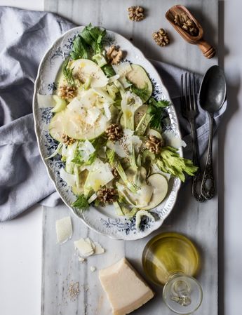Gourmet salad with fruits, cheese and nuts