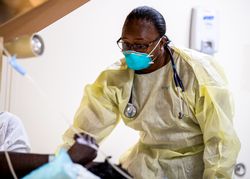 Los Angeles, CA, USA - April 1, 2020: Lt. j.g. Nichelle Bryant treats a patient aboard USNS Mercy