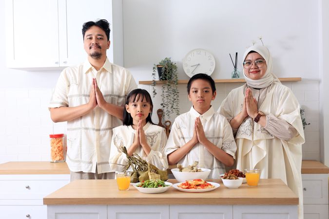 Asian Muslim Family Greeting for Eid Al Fitr