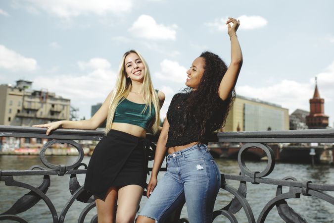 Cheerful friends on city river