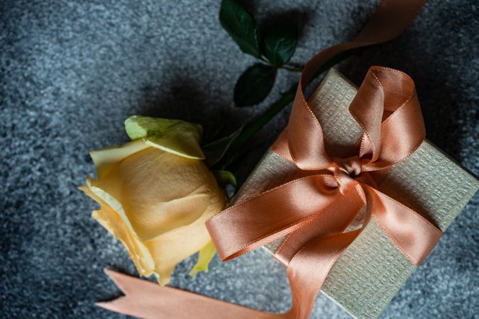Yellow flowers and gift with pink ribbon