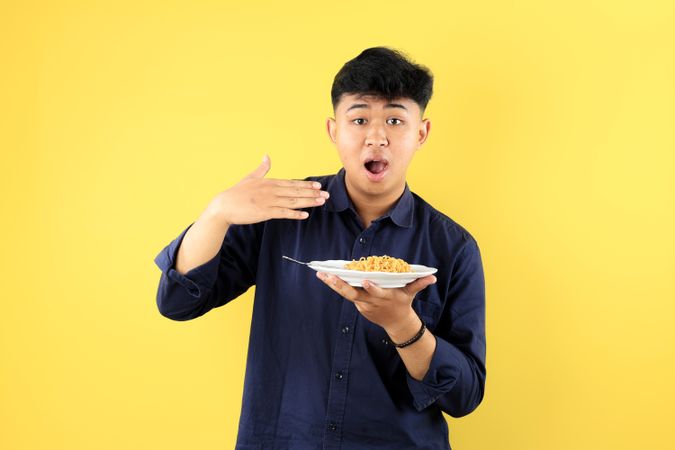 Young Male Eat Very Hot Mie Goreng