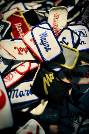Vintage name patches in a pile