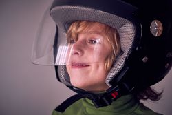 Happy little boy in safety helmet