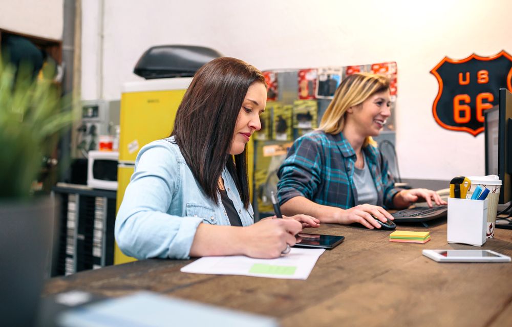 Cheerful women entrepreneur working selling on line in a small business