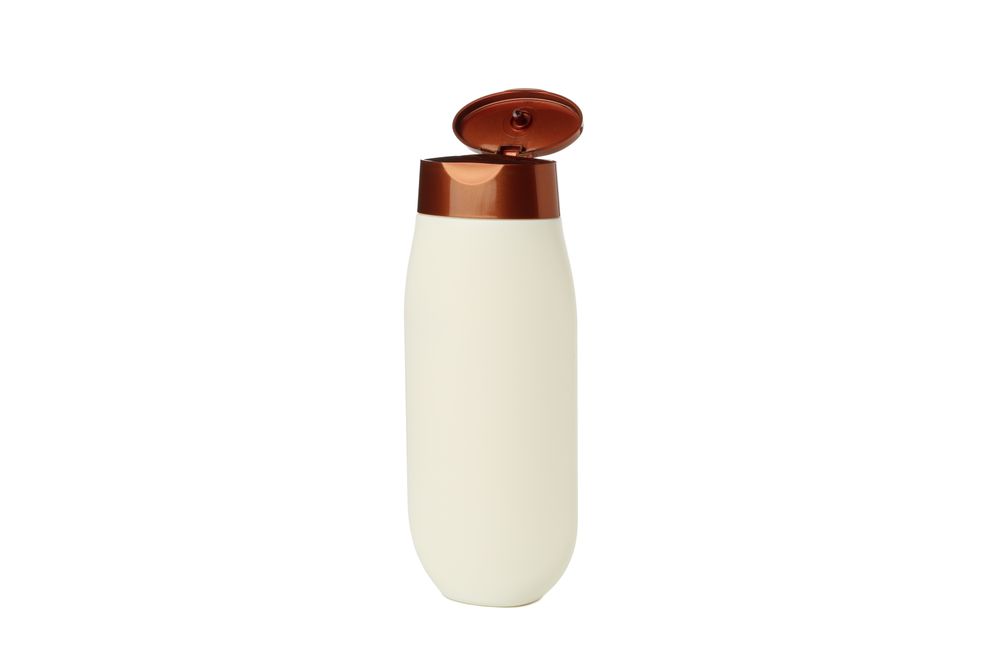 Blank plastic shampoo or lotion bottle isolated on light background
