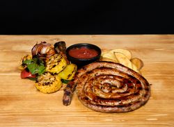 Fried meat and vegetables near ketchup