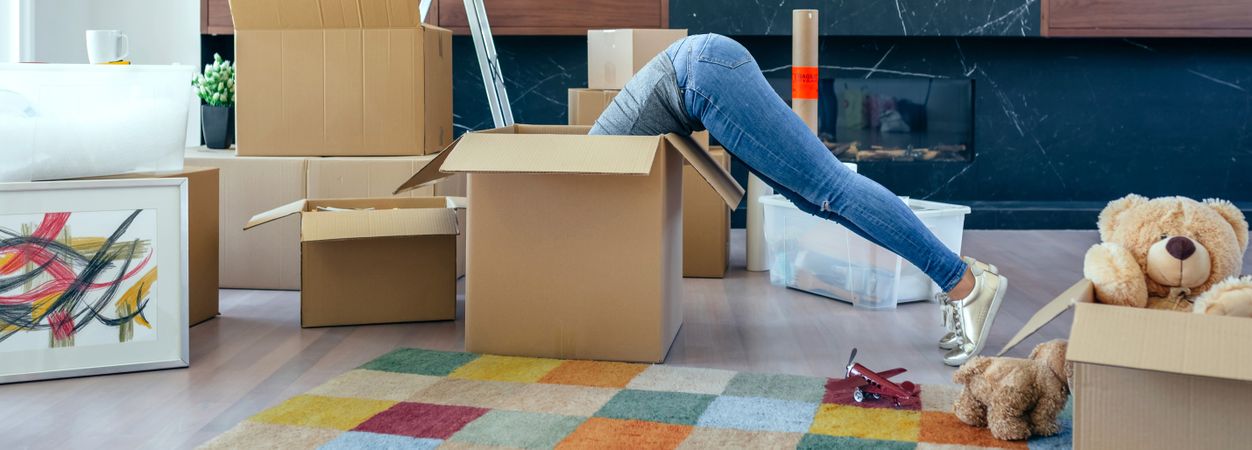 Woman inside a box preparing the move