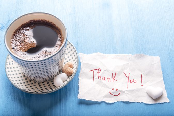 Coffee cup and cute thank you note