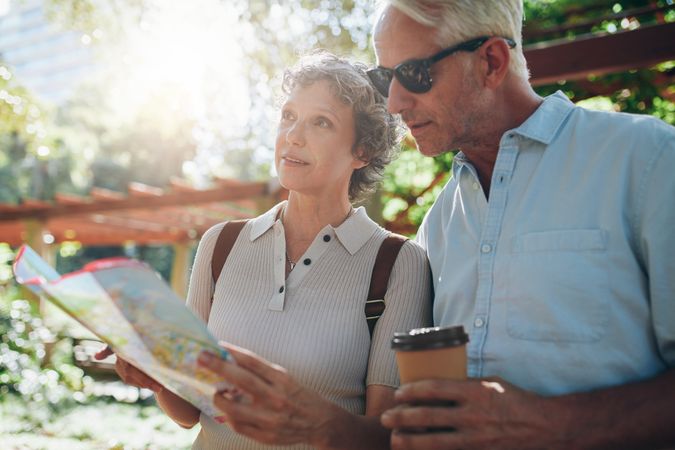 Older couple exploring new places to visit during their vacation