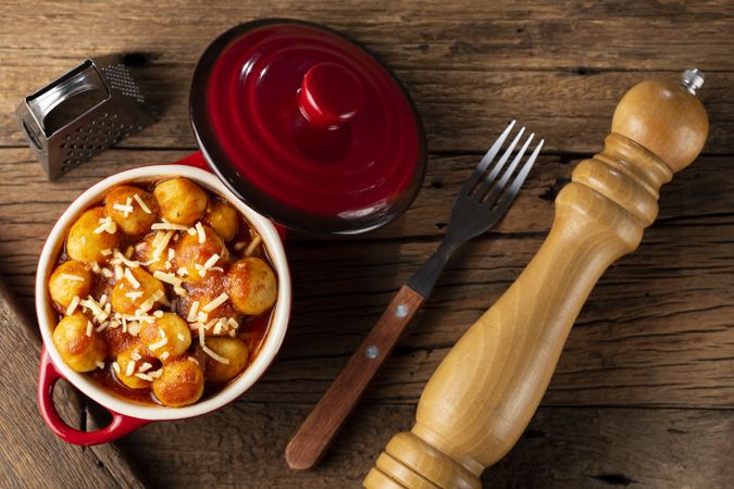 Gnocchi with tomato sauce and grated Parmesan cheese.