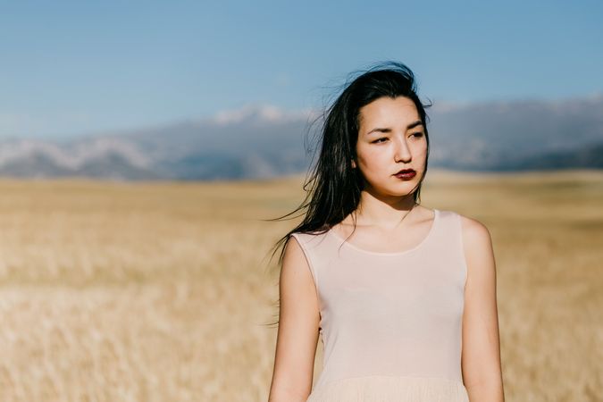 Portrait of female standing in field