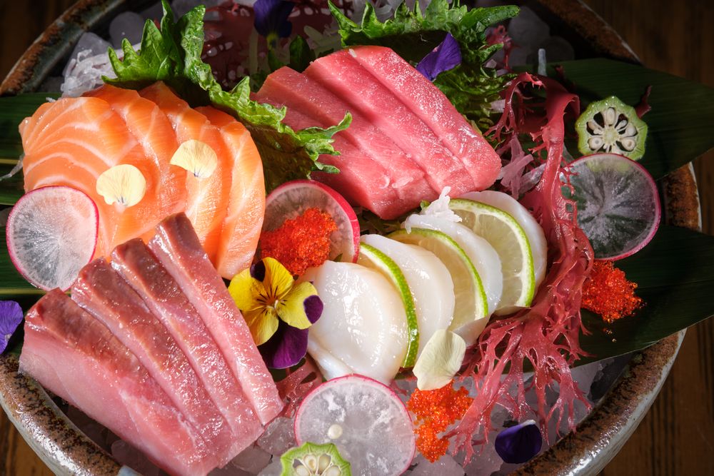 Sashimi dish served with fish and vegetables
