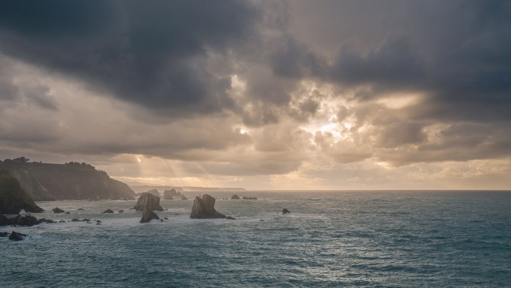 Beautiful bay around rocks and cloudy sunset