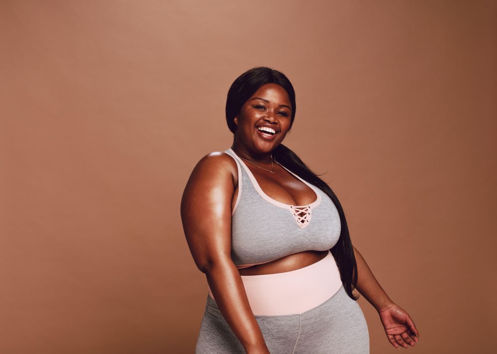 Beautiful plus size woman smiling happily in underwear – Jacob