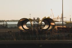 New metal pipes locating on industrial ground