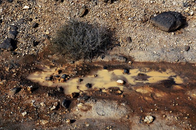 Dirty clay water with rocks