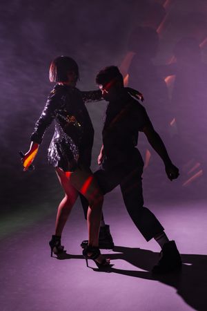 young dancers near smoke