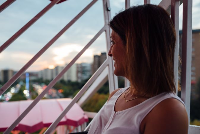 Mother riding Ferris wheel