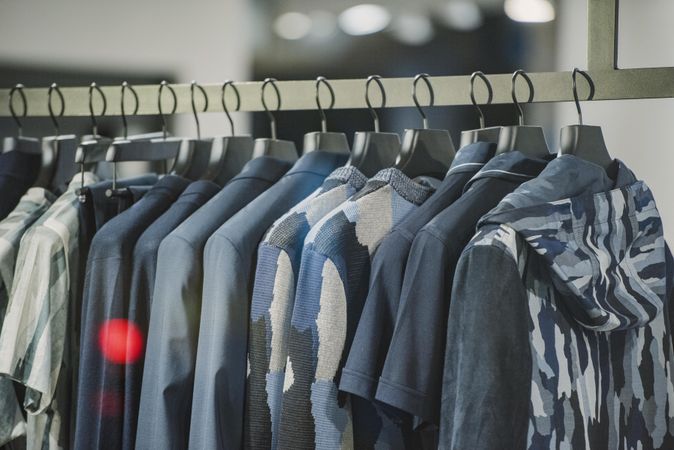 Clothes rack gray and blue outwear in fashion store