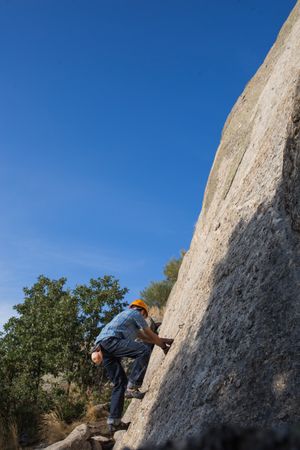 Free climber climbing in nature
