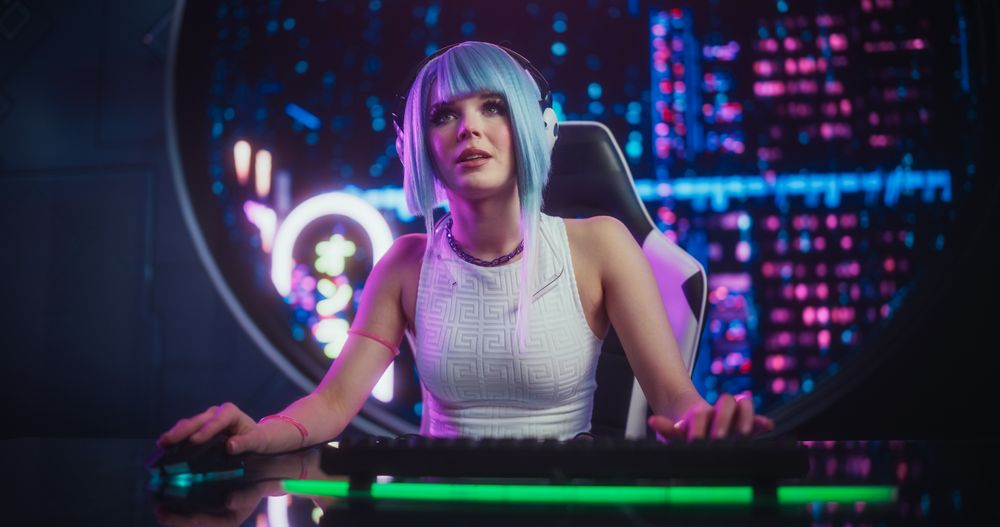 Happy Cosplayer Chats Online with Friends on Computer, Surrounded by Cyberpunk Style Background.