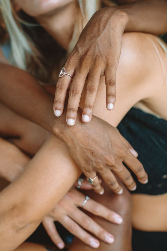 Group of women from different ethnicity wearing silver rings