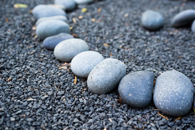 Curved line of rocks on smaller pebbles