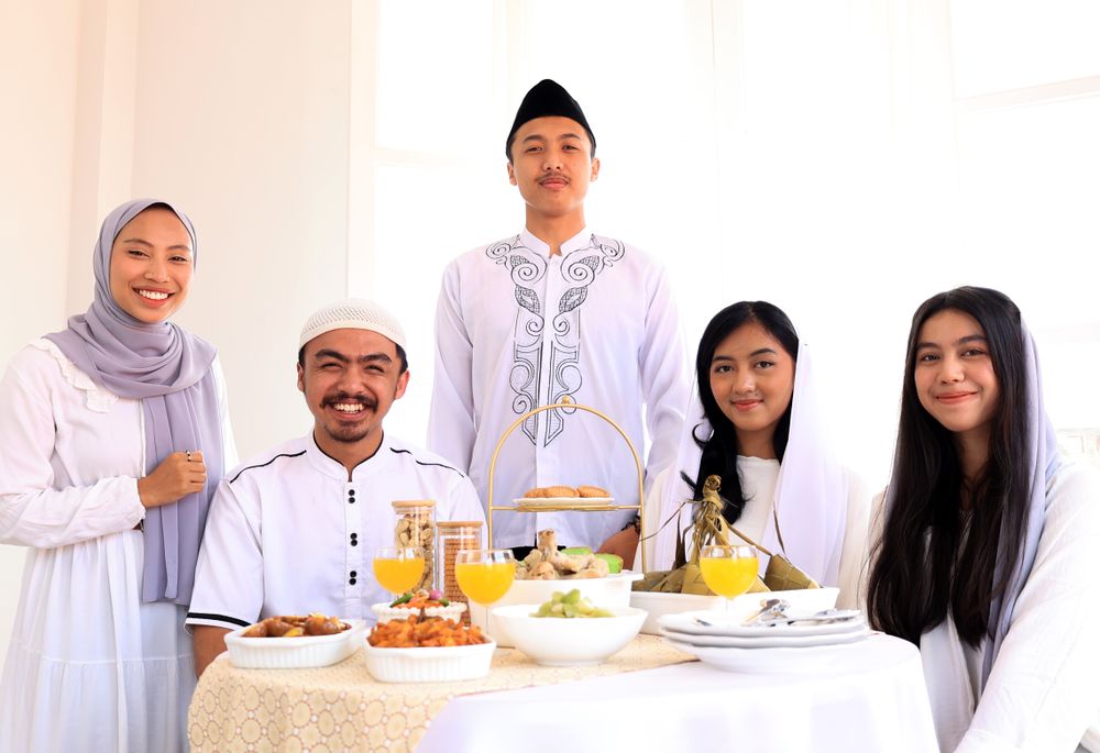 Eid Mubarak Muslim Family Having Iftar dinner Eating Traditional Food