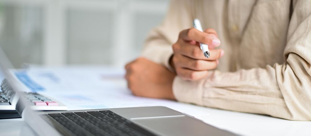 Male hands on desk with laptop