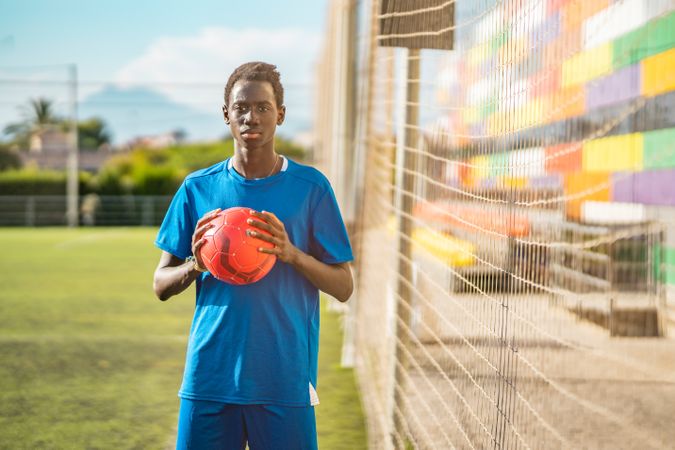 Black teenager on football field