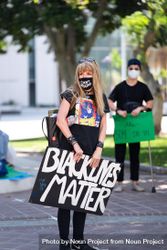 Los Angeles, CA, USA — June 16th, 2020: woman standing at solidarity rally beXW34