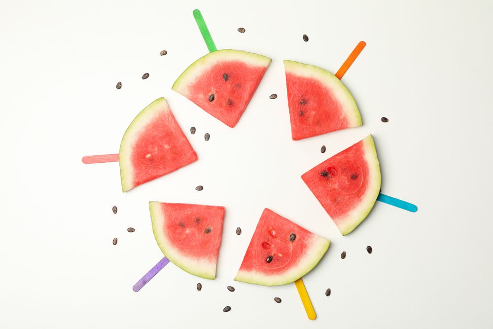 Composition with fresh watermelon slices on blank background, top view
