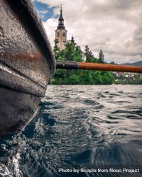 Selective focus photo of boat and paddle in water 5zPxXb