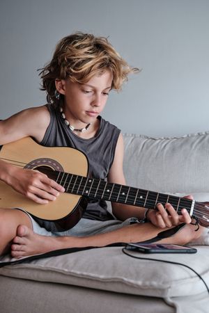 Child playing the guitar