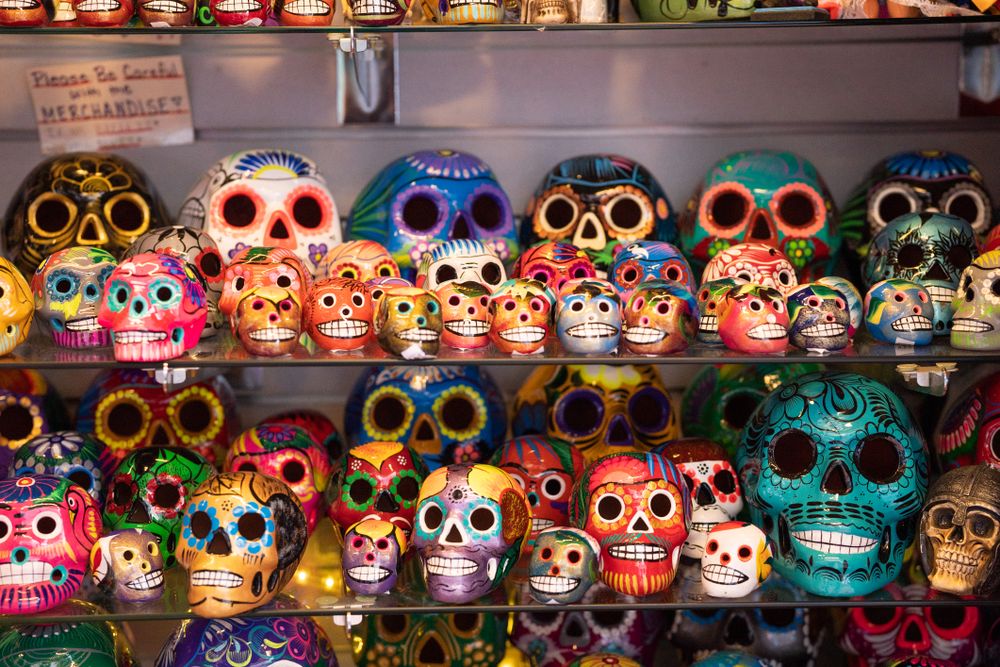 Rows of painted ceramic skulls for sale