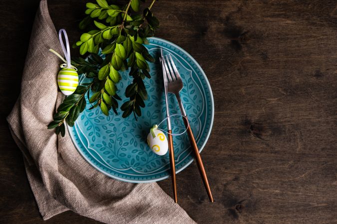Top view of blue plate with eggs for spring table setting