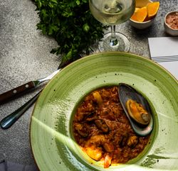 Risotto with sea food served with wine