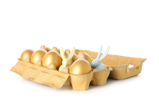 Concept of Richness, golden eggs, isolated on blank background