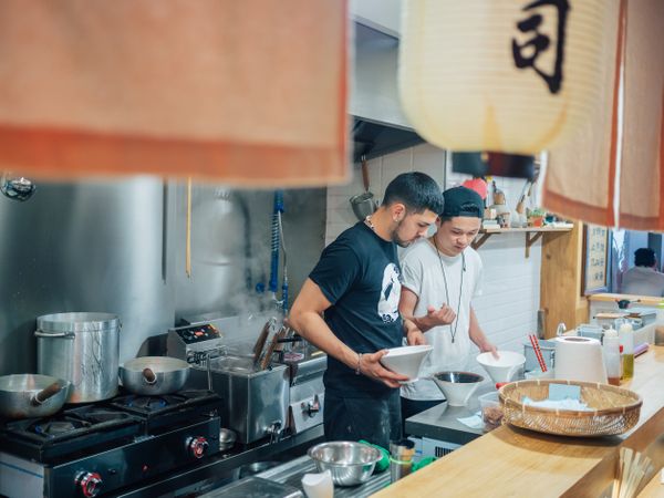 Kitchen staff in Asian cafe