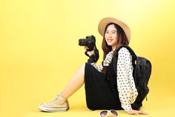 Young Asian Woman Backpacking Concept with Camera and Hat Straw,