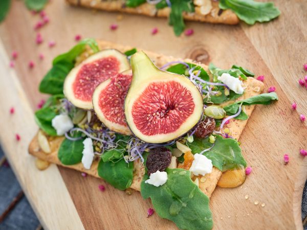 Delicious figs on wooden board