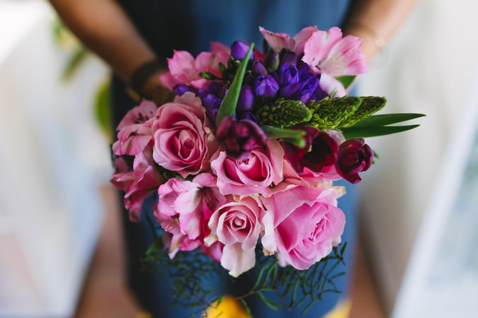 Close up of flowers in hands of florist