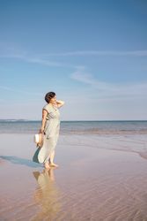 Woman gazing at sea horizon