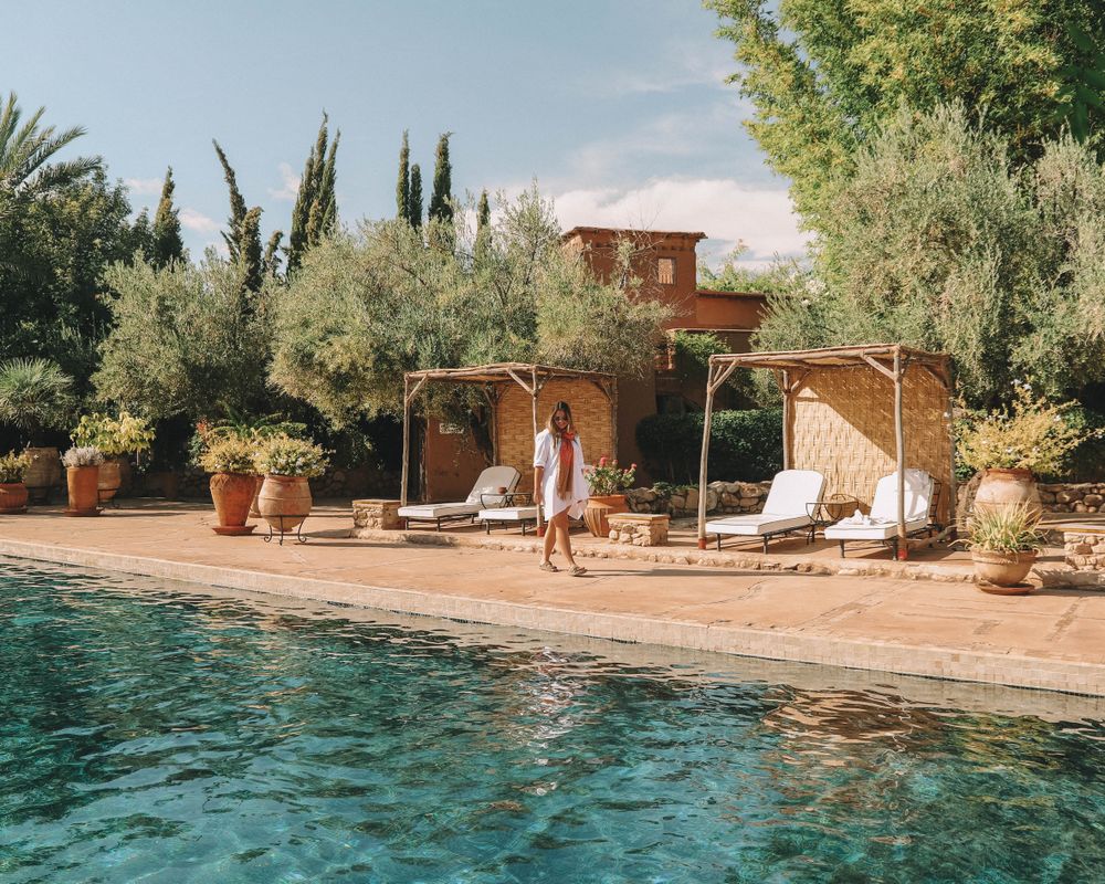 Woman standing near swimming pool