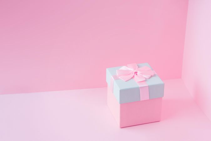 Pink and baby blue jewelry gift box on pastel backdrop
